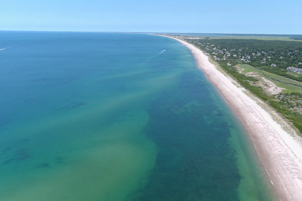 Cape Cod shoreline and green shallows viewed from above