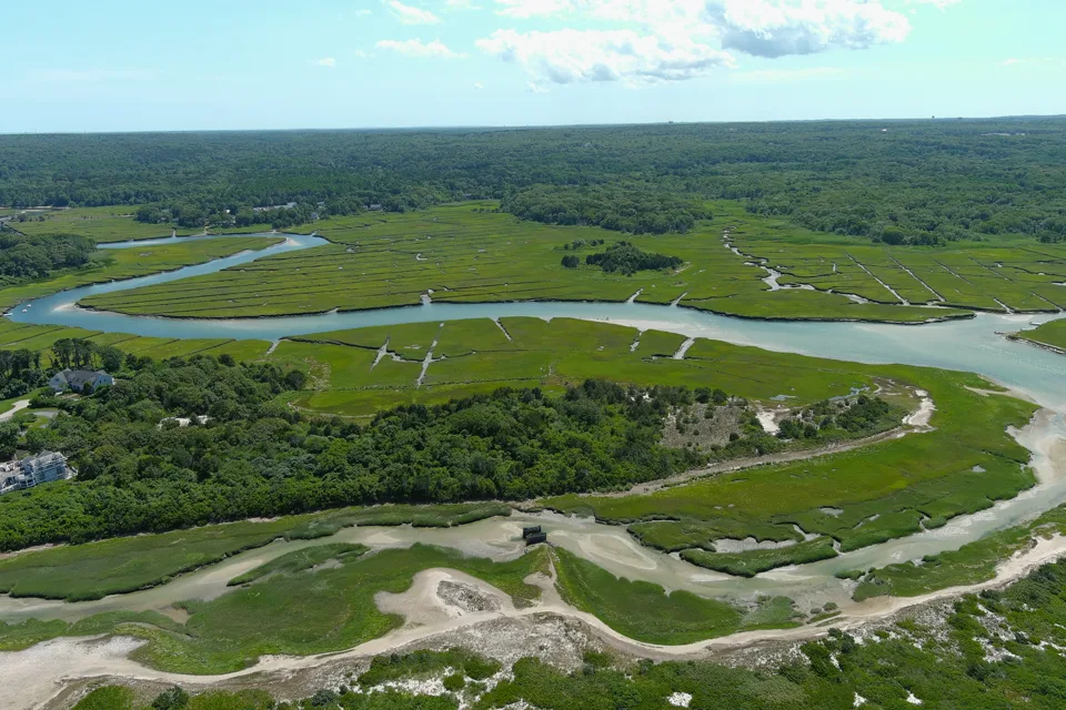 Cape Cod waterways winding through marshes toward a distant coastline